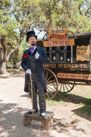 Ross Nelson portraying a snake-oil salesman at the Enchanted Springs Ranch and Old West theme park in Boerne, Texas
